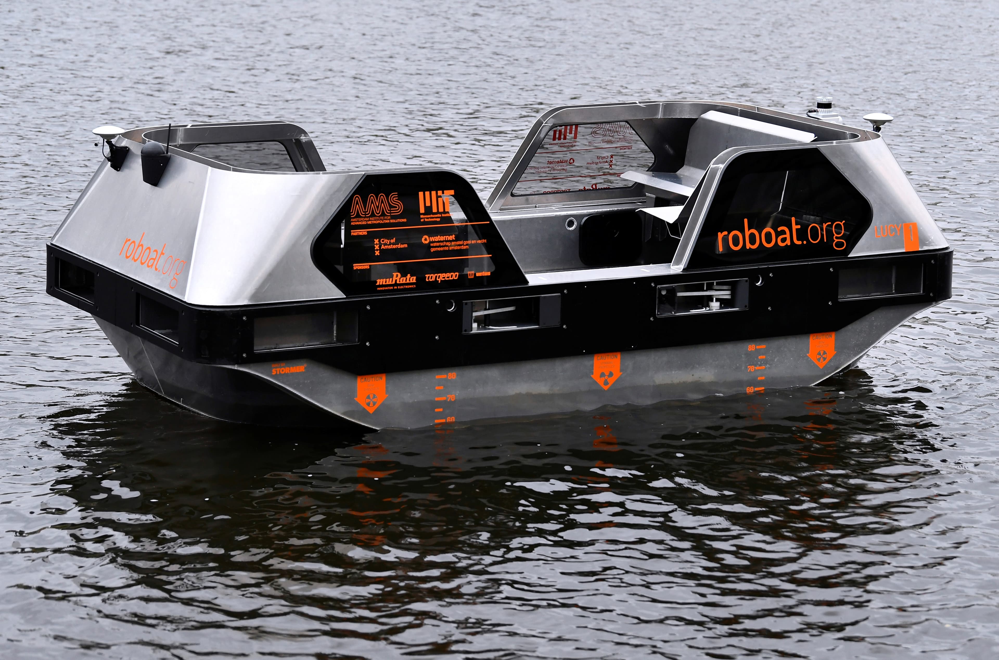 The Roboat watertaxi 'Lucy' on the water in Amsterdam.
